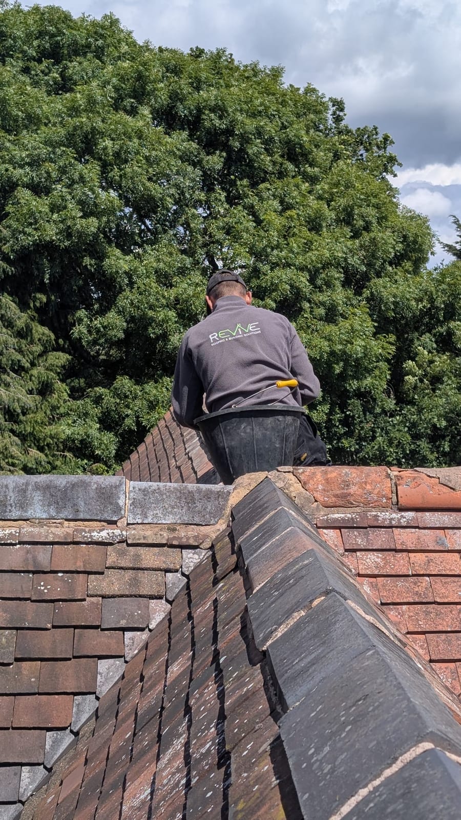 Finishing touches to ridge tile bedding and pointing
