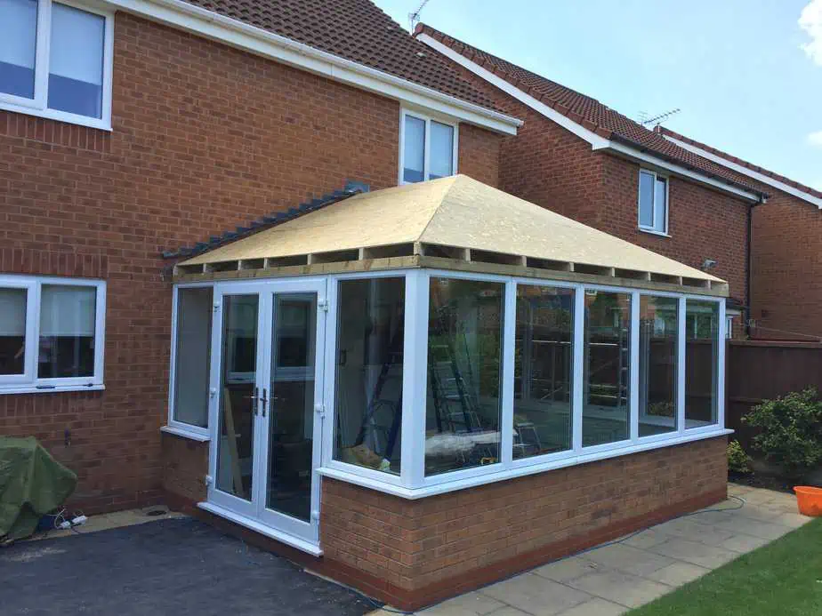 Conservatory with its new solid roof structure taking shape ahead of tiling